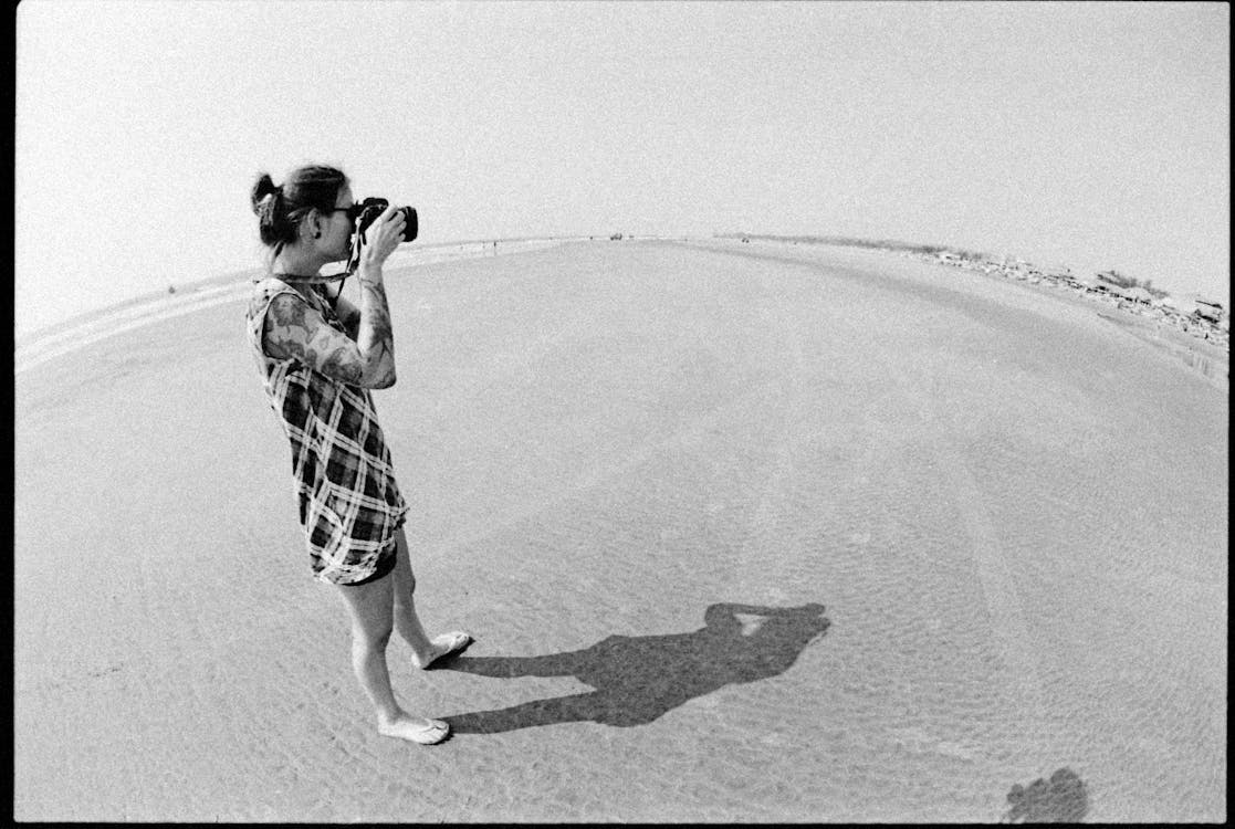 Black and White Photo of Woman Taking Photo with a Camera · Free Stock ...