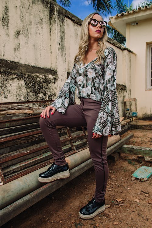 Woman Wearing White, Green, and Gray Floral Long-sleeved Top and Gray Pants