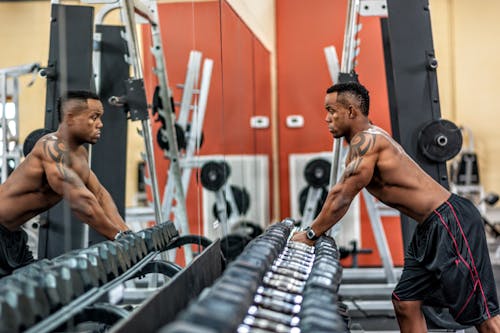 Free Man in Red and Black Shorts Stock Photo