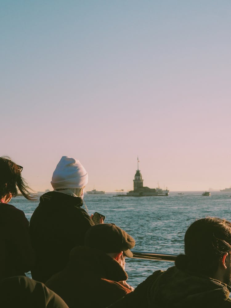 People Looking At Lighthouse 