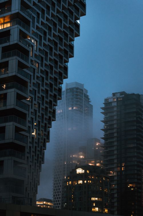 Free Foggy evening view of Vancouver skyscrapers with modern architecture. Stock Photo