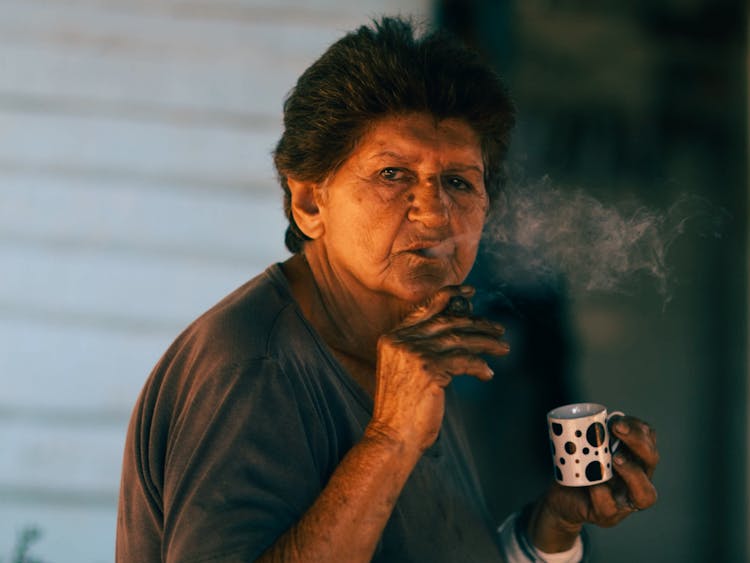 Elderly Woman Smoking Tobacco