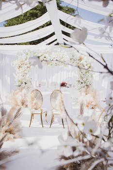 Beautifully arranged wedding setup with white floral and elegant seating outdoors in Angola.
