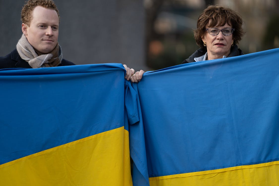 Free People Holding Ukrainian Flags Stock Photo