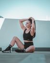Woman in Black Sports Bra and Black Leggings Doing Yoga