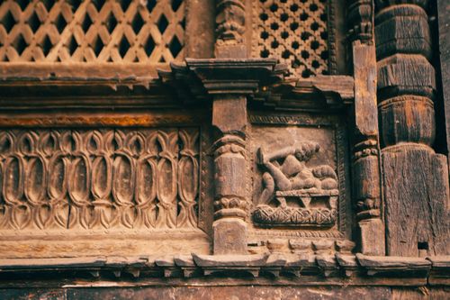 Free Detailed bas-relief carving on an ancient facade showcasing Pre-Columbian art. Stock Photo