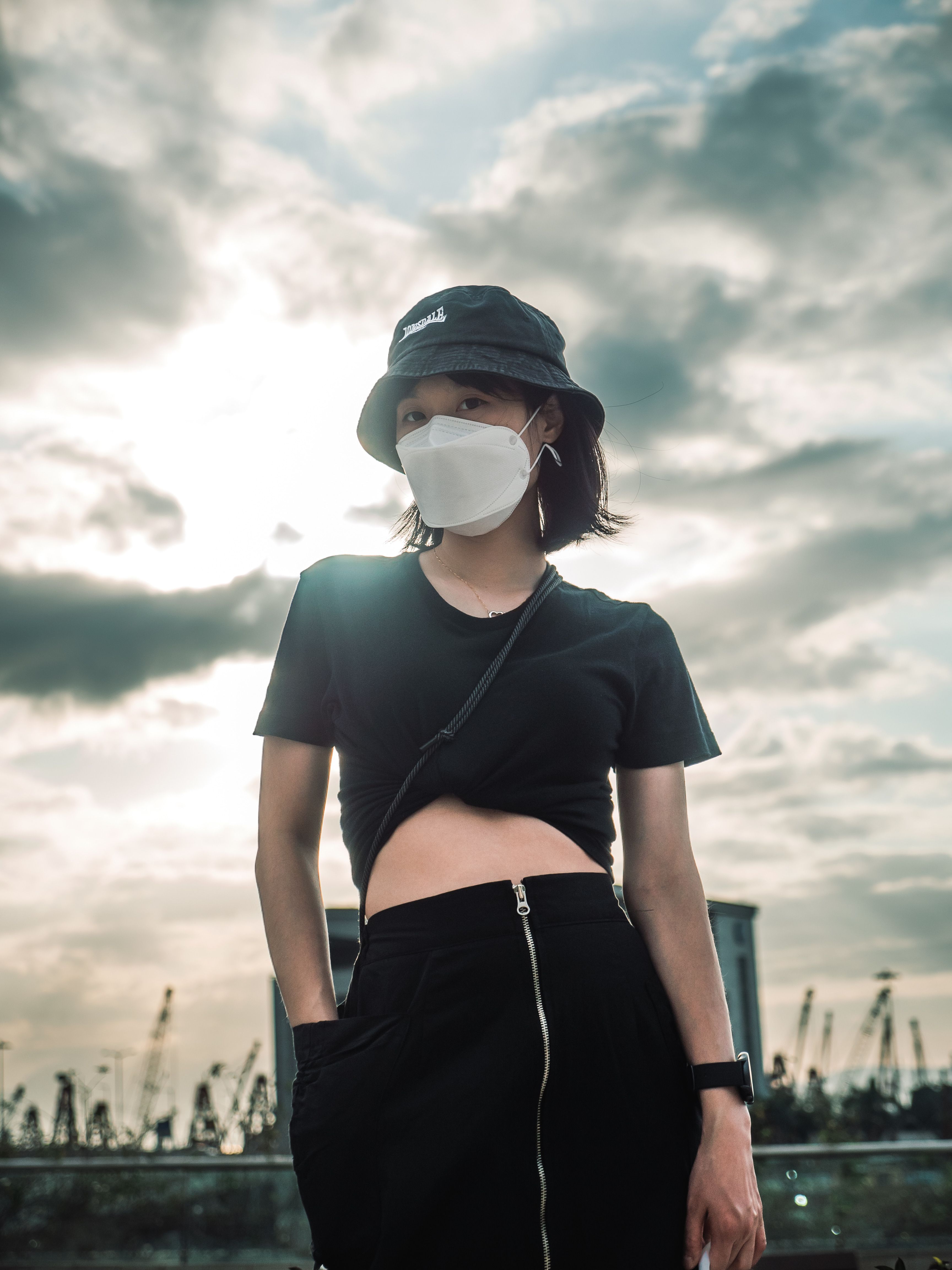Woman in Black Crop Top Wearing a Face Mask · Free Stock Photo