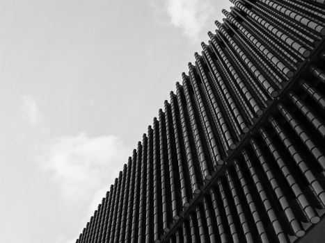 Black and white photo of a modern building facade in Kowloon, Hong Kong.