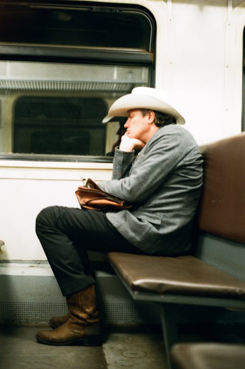A Man Napping on a Public Transportation