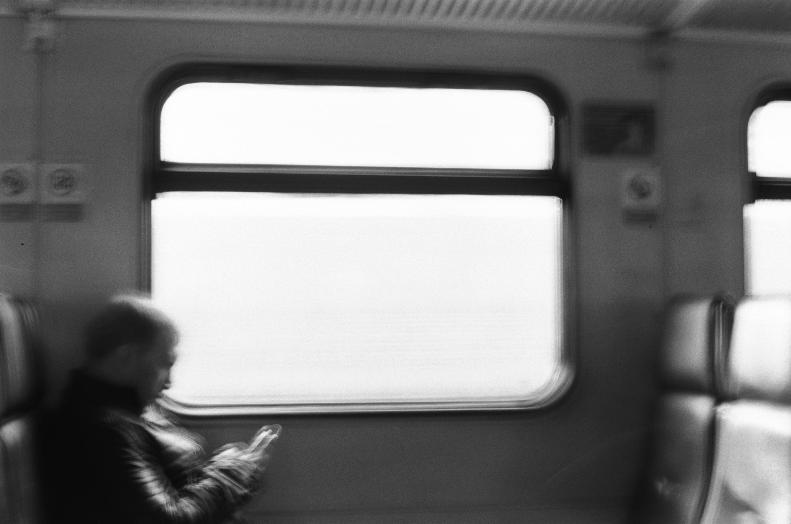 Young Man Looking Out Of Train Window Stock Photo - Download Image