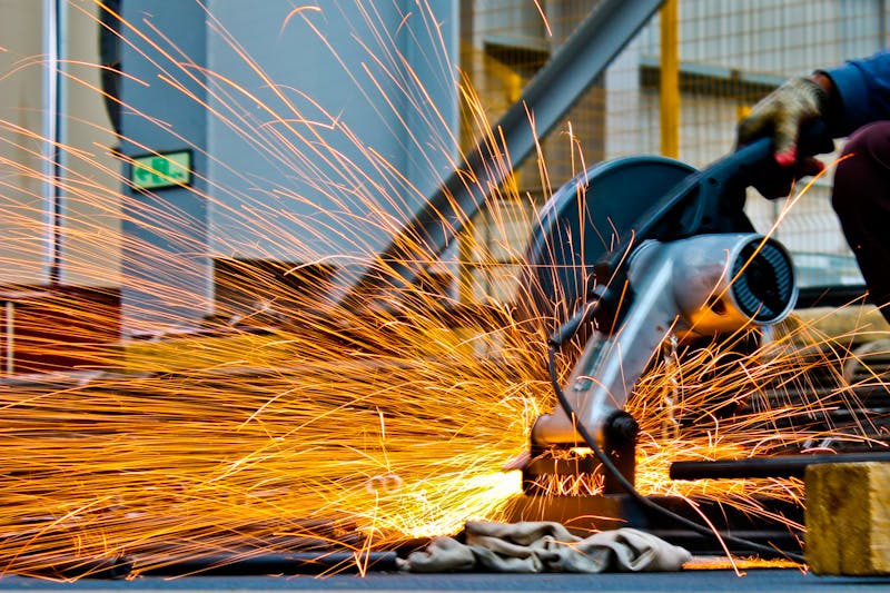 Sparks from metal processing in an industrial workshop