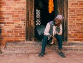 Man Sitting on the Dooraway