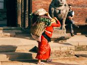 Woman Carrying a Heavy Basket