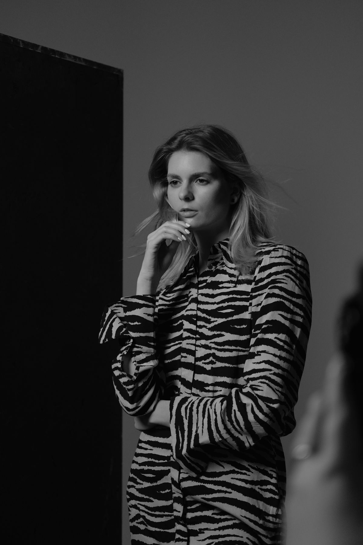 A woman posing in an animal-print dress — the confidence of leopard