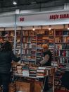 Man Getting a Book from a Bookcase