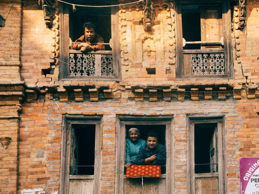diverse people looking out windows