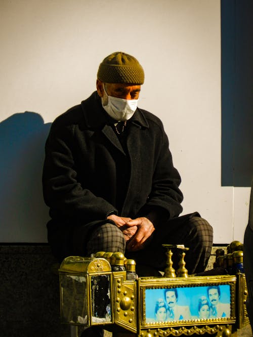 Elderly Man in Black Jacket Wearing White Face Mask