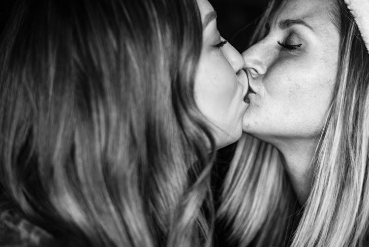 Black And White Photo Of Women Kissing