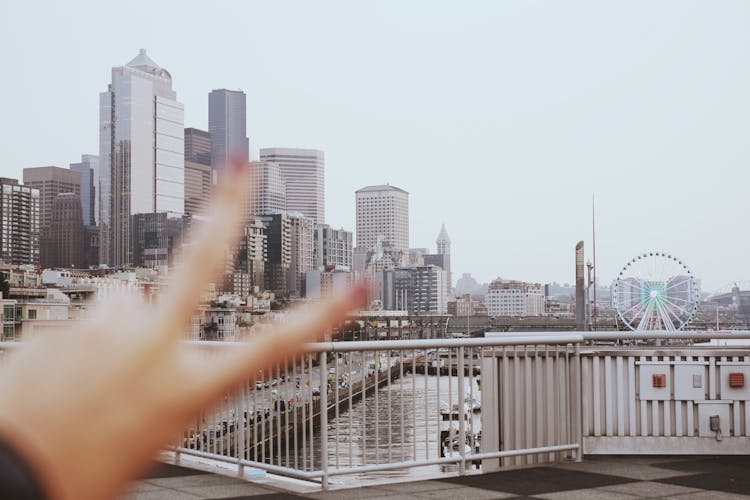 Hand With Victoria Gesture On Seatle Skyline, Washington, USA