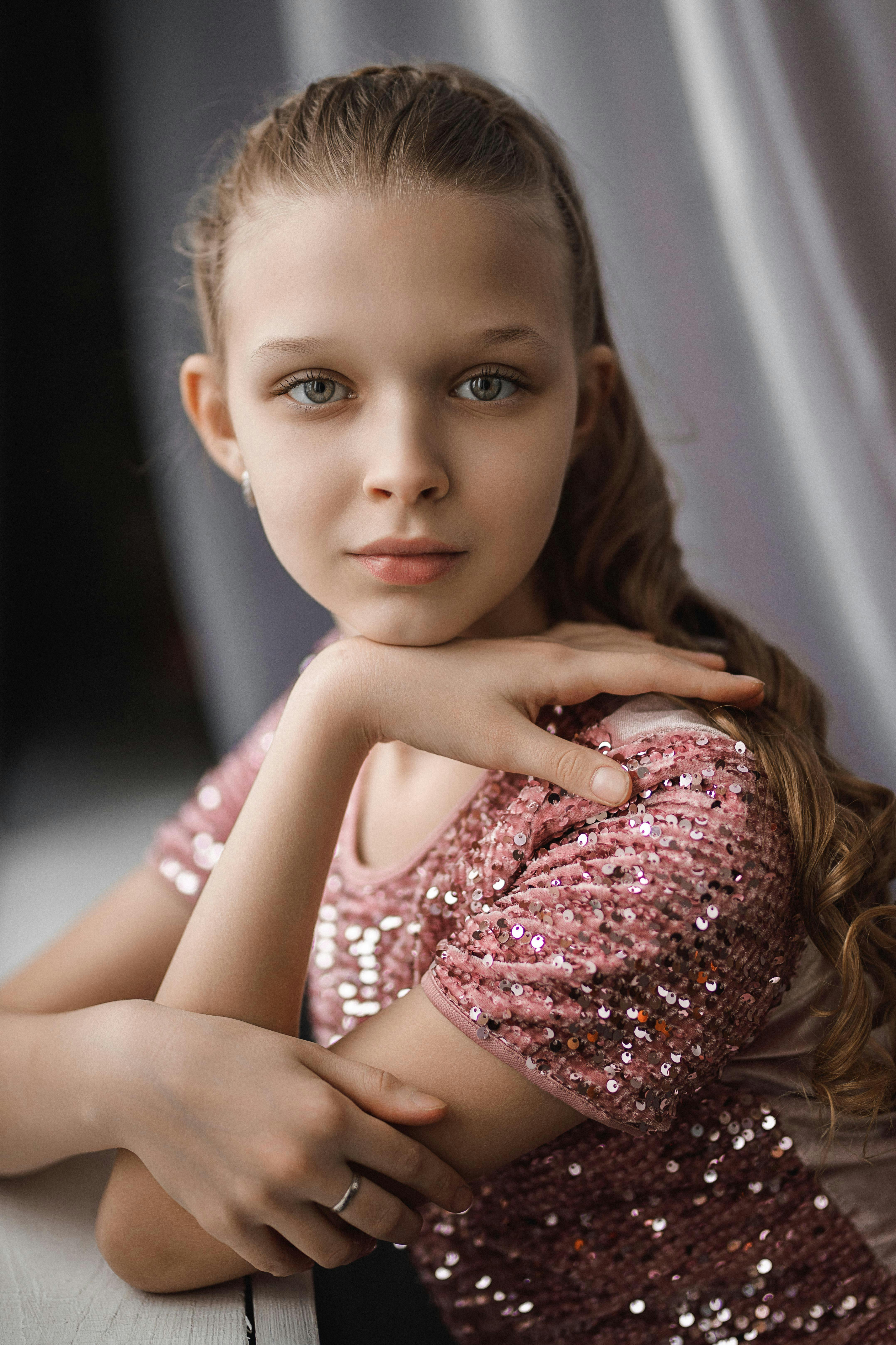 portrait of girl resting chin on hand