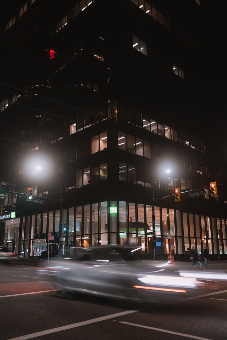 Blurred Car On Street At Night