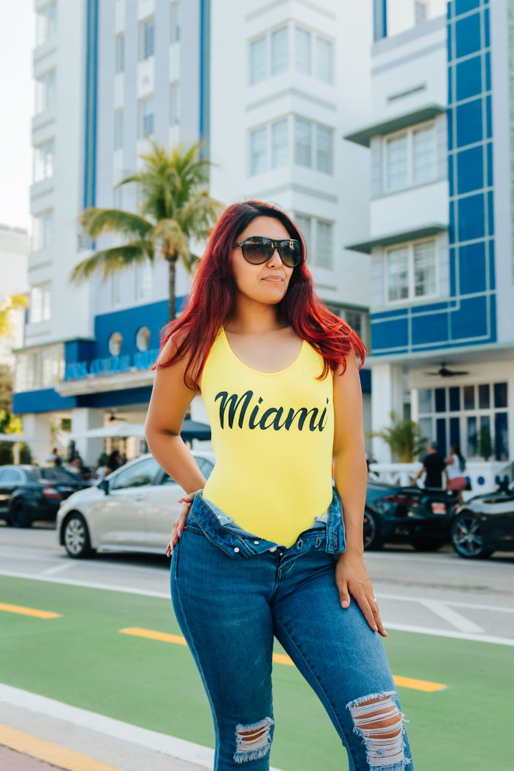 Woman In Swimsuit And Jeans On Streets Of Miami