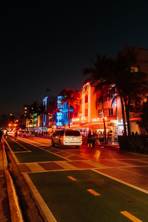 Illuminated City Street at Night
