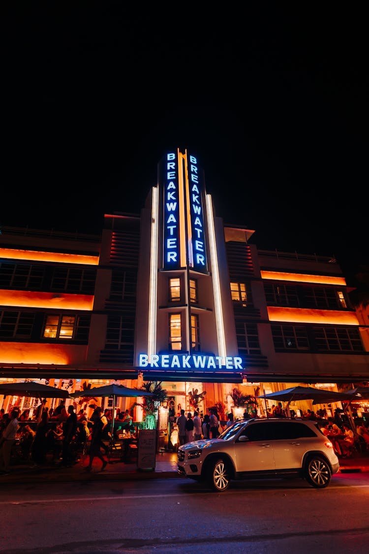 Car And People Near Casino At Night