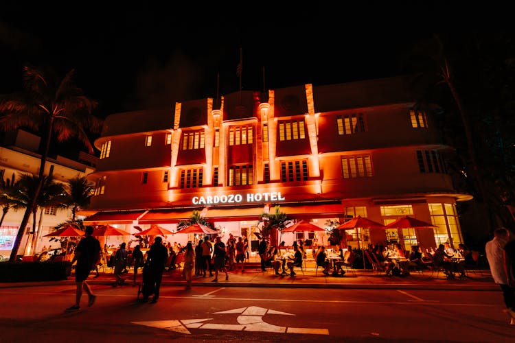 Illuminated Hotel Near Street At Night