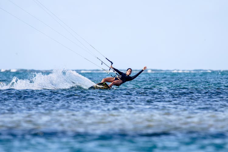 Woman Surfing On Wakeboard