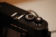Black and Silver Camera on White Table