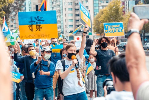 Crowd with Ukrainian Flags on Street
