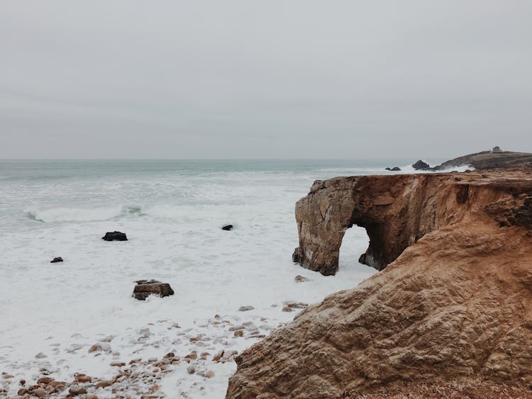 Ocean Waves Breaking At The Arch At Port Blanc, Quiberon Peninsula, Brittany, France