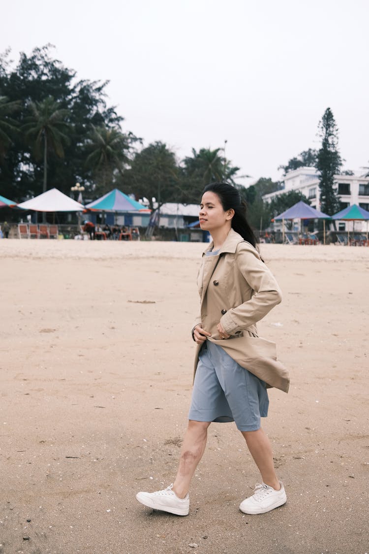 Woman Walking On Beach