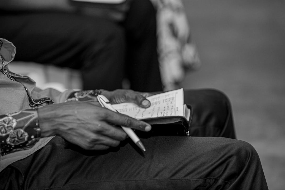 Quarterback scanning the field from the pocket with offensive linemen in protection