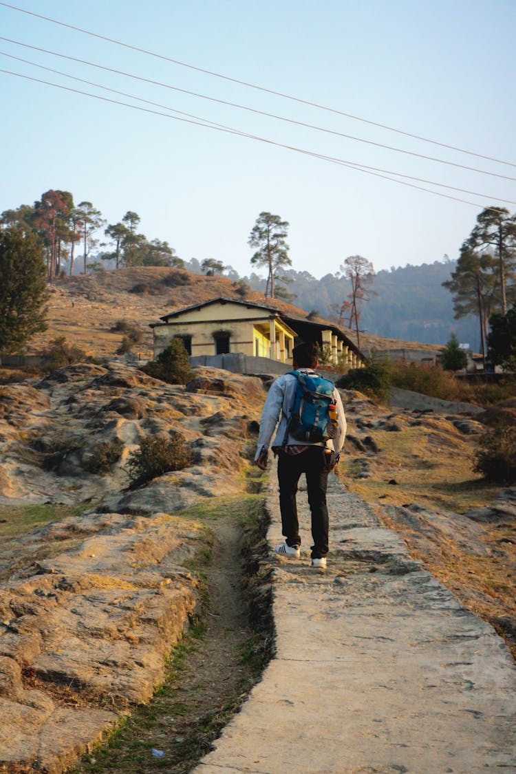 Man Walking With A Backpack 