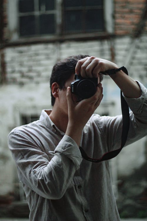 Man Taking Photo with a Camera