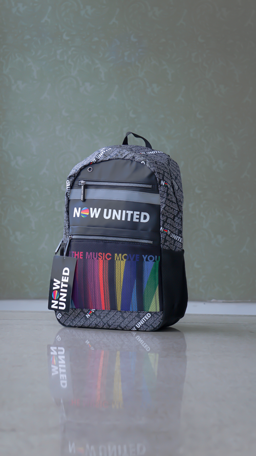 Free Stylish backpack featuring Now United branding with vibrant colors. Stock Photo