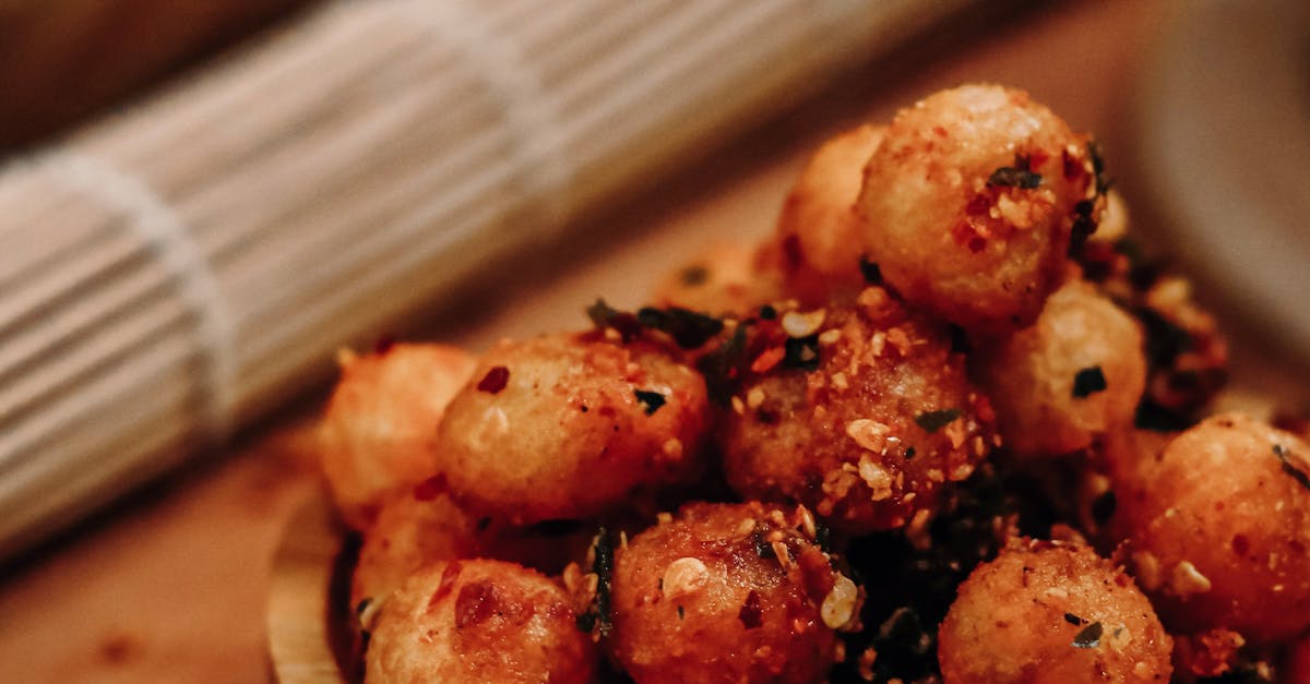 A Set of Fried Ball Shaped Food on a Wooden Bowl · Free Stock Photo