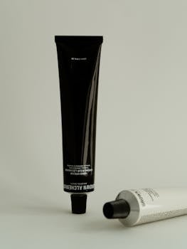 Stylish minimalist shot of premium skincare product tubes with clean aesthetic.