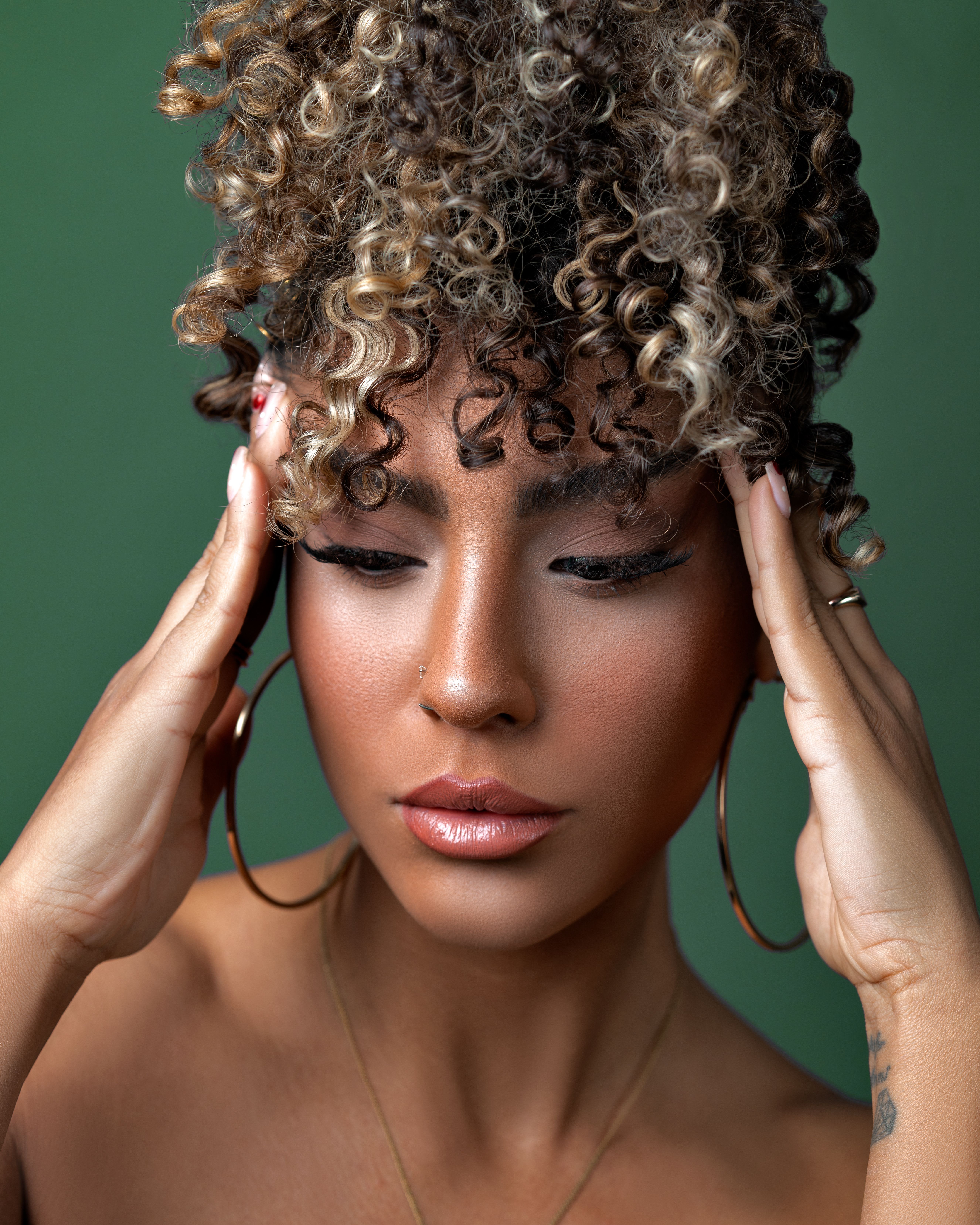 Portrait of Curly Haired Woman with Eyes Closed · Free Stock Photo
