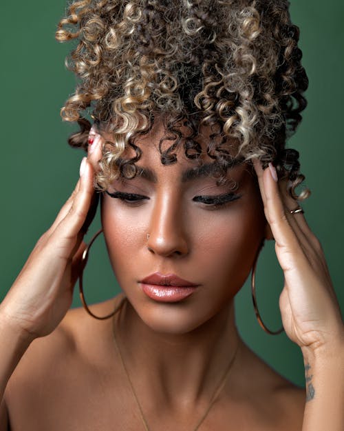 Portrait of Curly Haired Woman with Eyes Closed