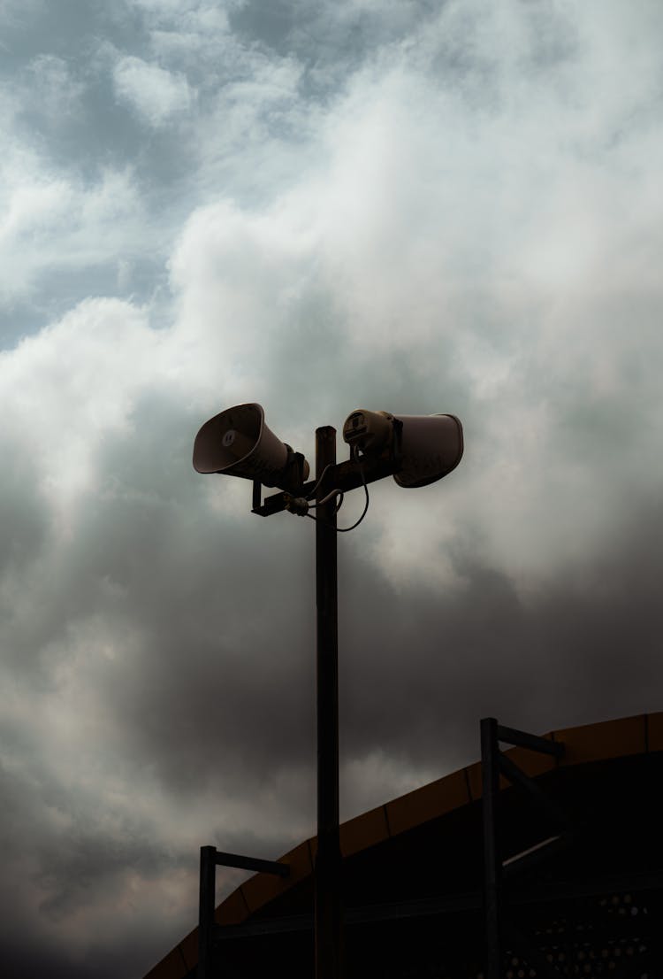 Clouds Over Loudspeakers On Post