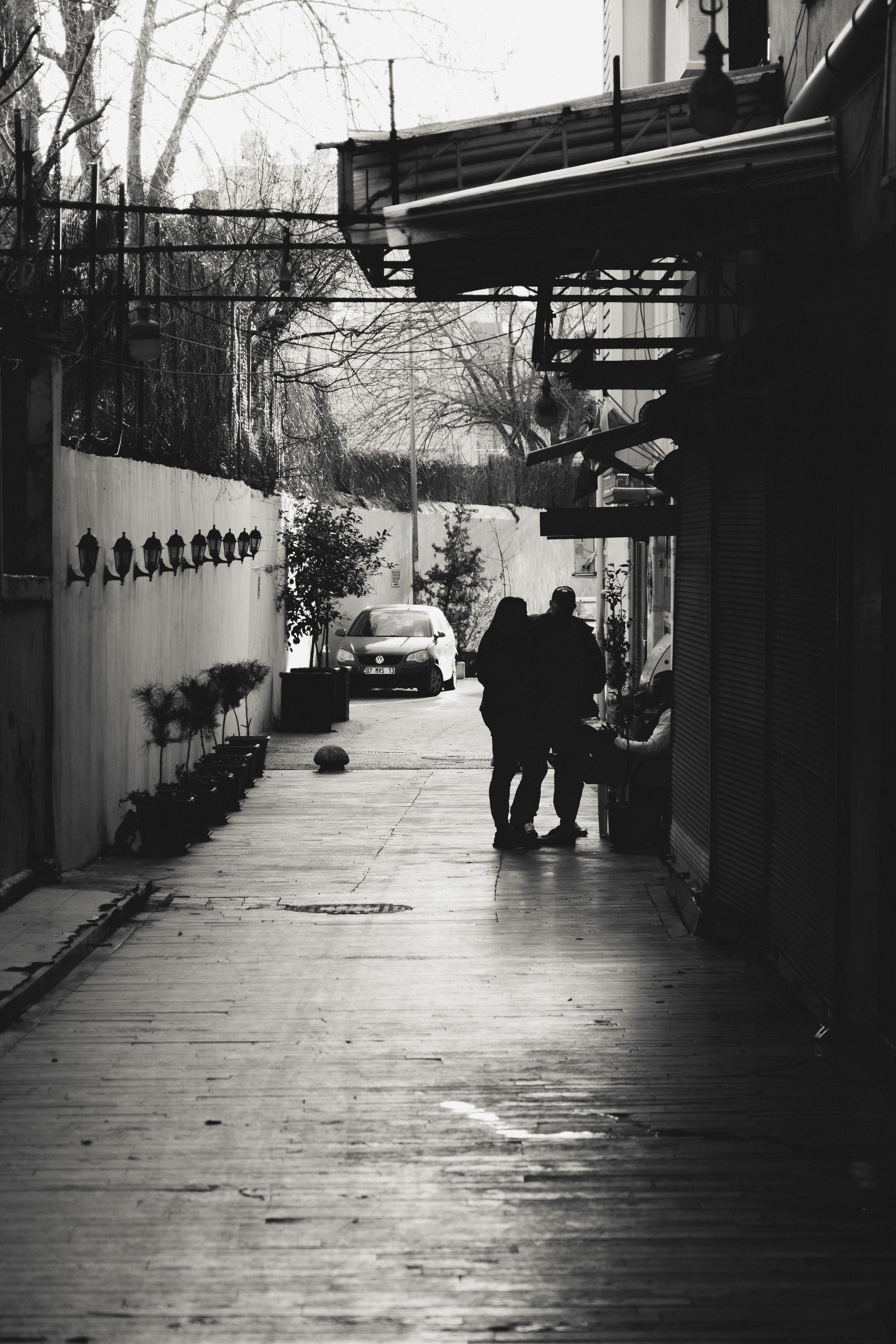 Grayscale Photo of People Walking on Sidewalk · Free Stock Photo