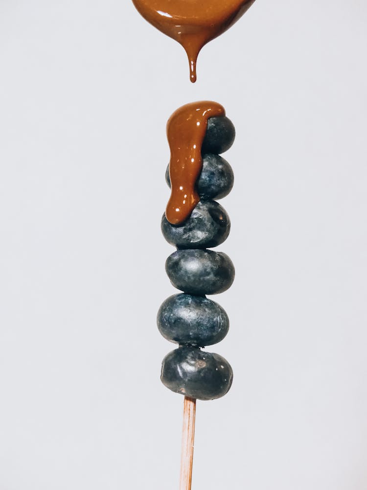 Chocolate Dripping On Blueberries 