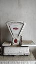 White and Red Analog Weighing Scale