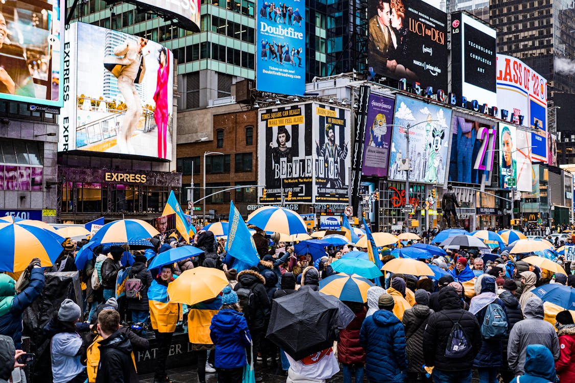 Free People Walking on Street With Umbrella Stock Photo