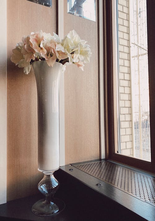 Flowers in a Vase by a Window