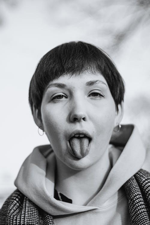 Woman in Short Hair with Tongue Out