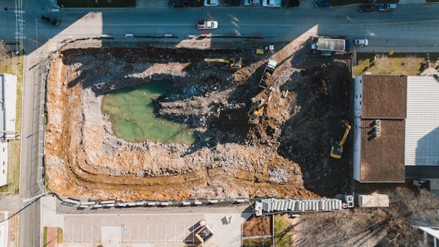 Drone image of a construction site in Nashville, TN, showcasing ongoing excavation work.